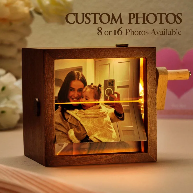 Primary — the lit walnut frame with photos mid-flip